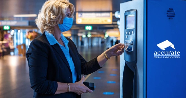 Woman paying at a parking garage kiosk