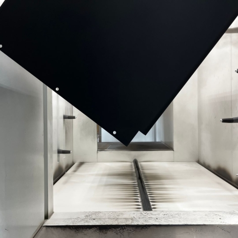 A metal enclosure being powder coated black